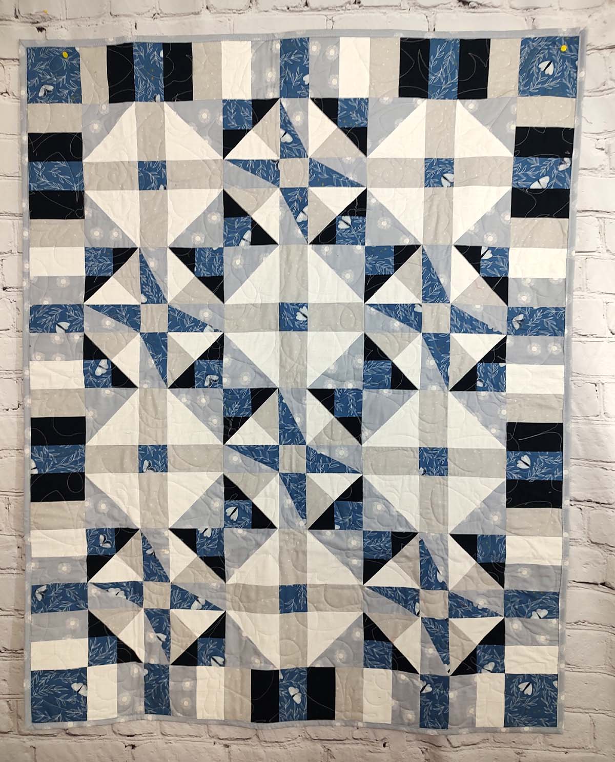 Blue and grey Modern Moth Fragility baby lap quilt