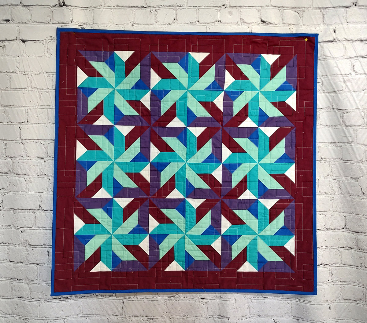 Whirling Star Solid colors purple and blue modern baby lap quilt