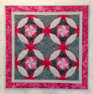 grey and pink baby quilt cat print in batiks