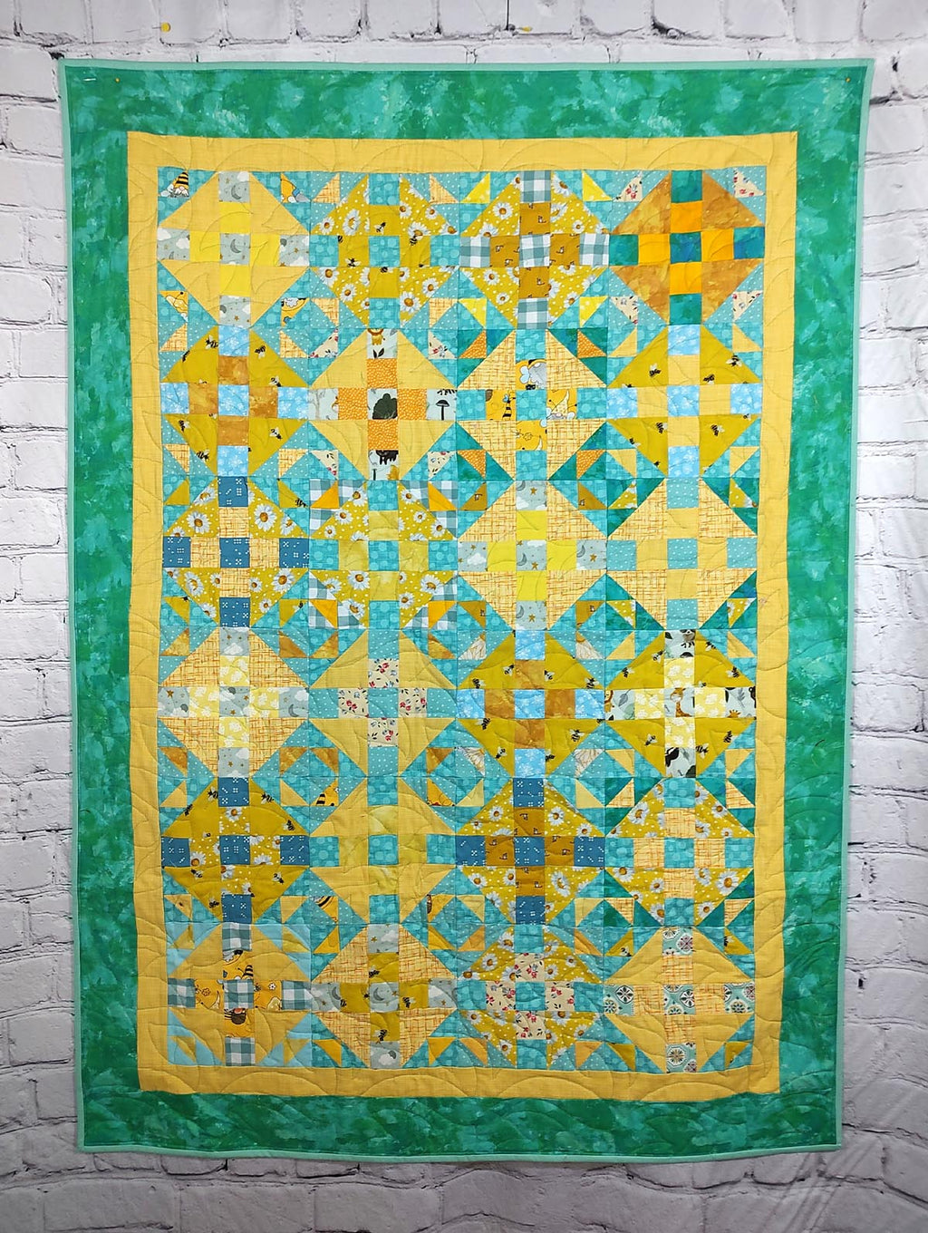 Turquoise and Yellow scrappy Duck Duck Goose baby quilt