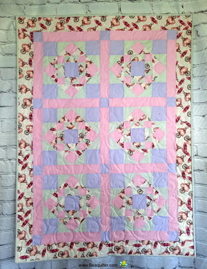 First Steps girl on a bike baby quilt