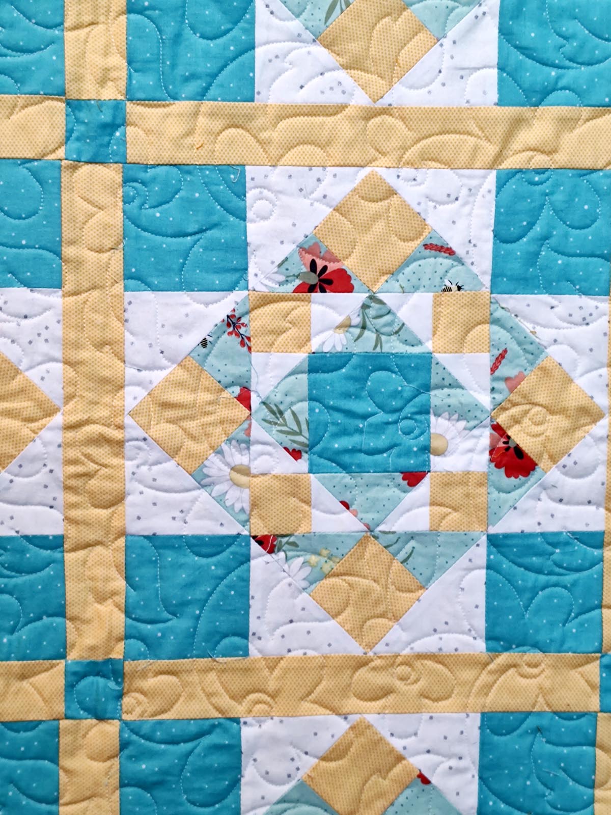 First Steps floral turquoise and yellow baby quilt