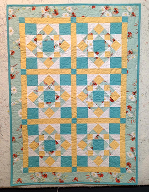 First Steps floral turquoise and yellow baby quilt