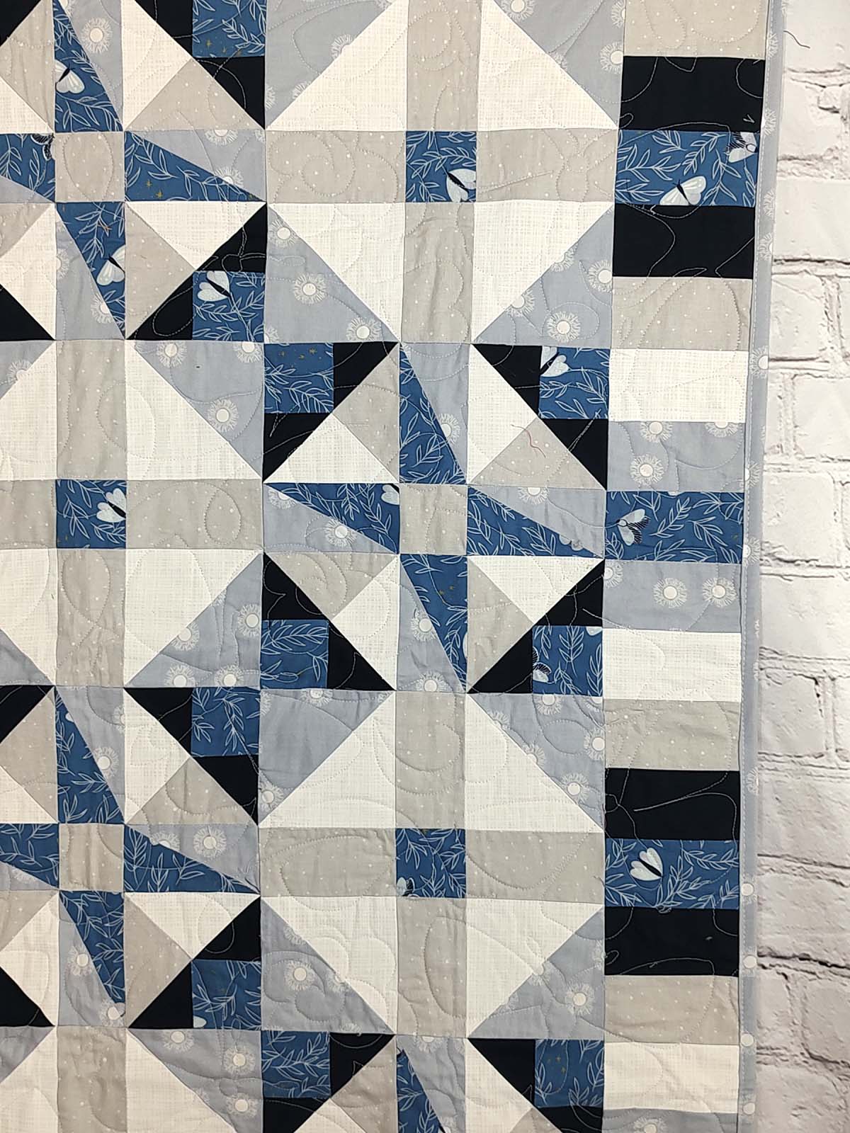 Blue and grey Modern Moth Fragility baby lap quilt