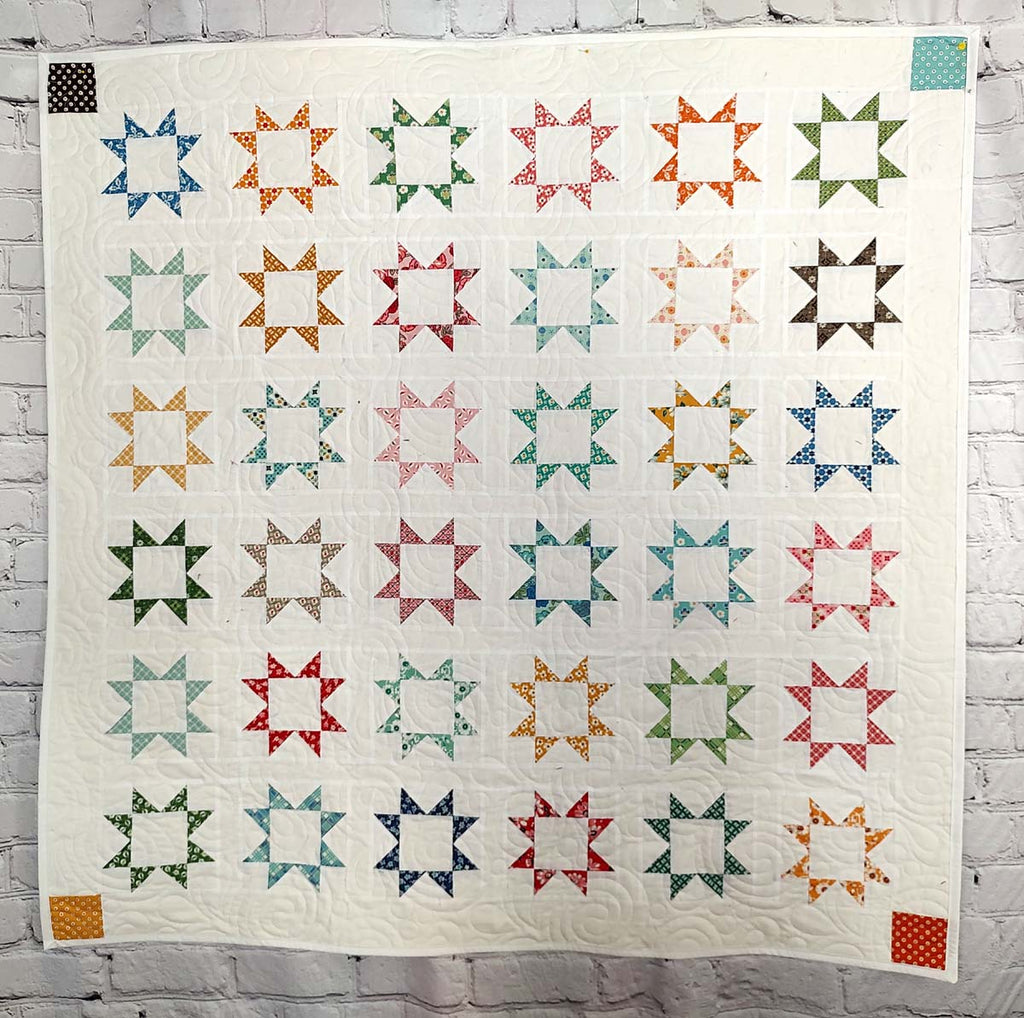 Stars Aligned Modern antique print baby quilt