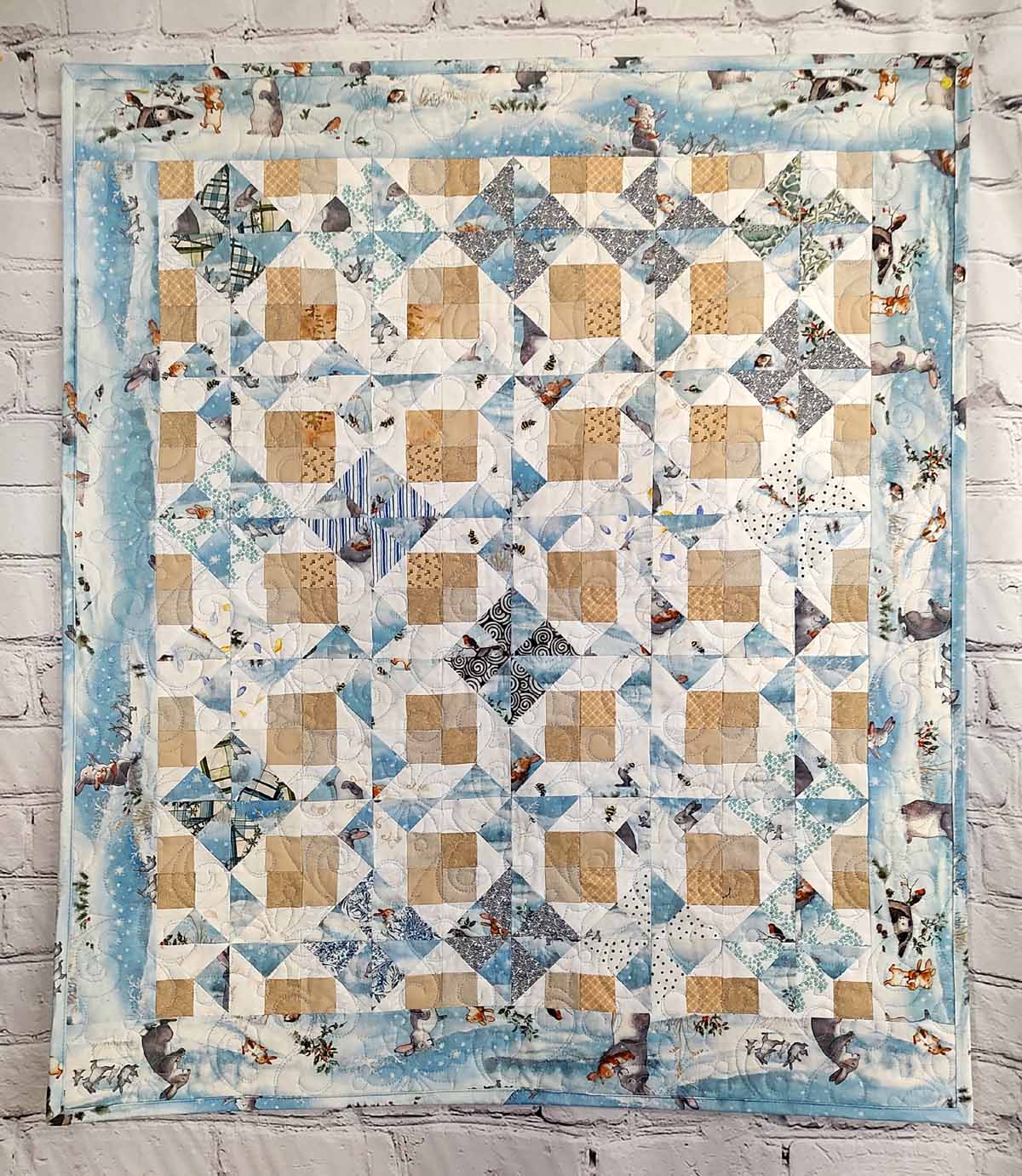 Snow Bunny blue and tan baby quilt