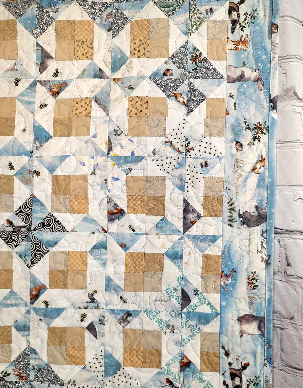 Snow Bunny blue and tan baby quilt