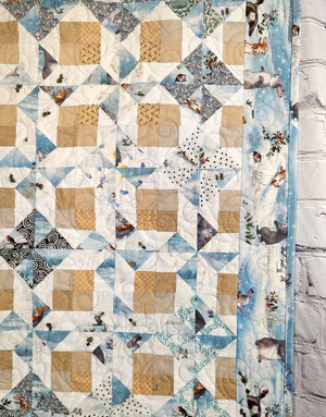 Snow Bunny blue and tan baby quilt