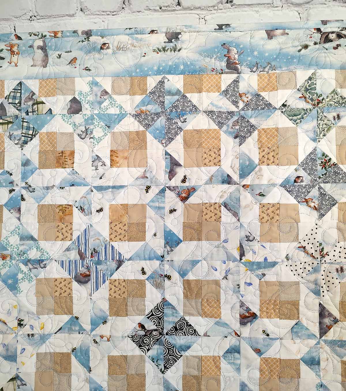 Snow Bunny blue and tan baby quilt