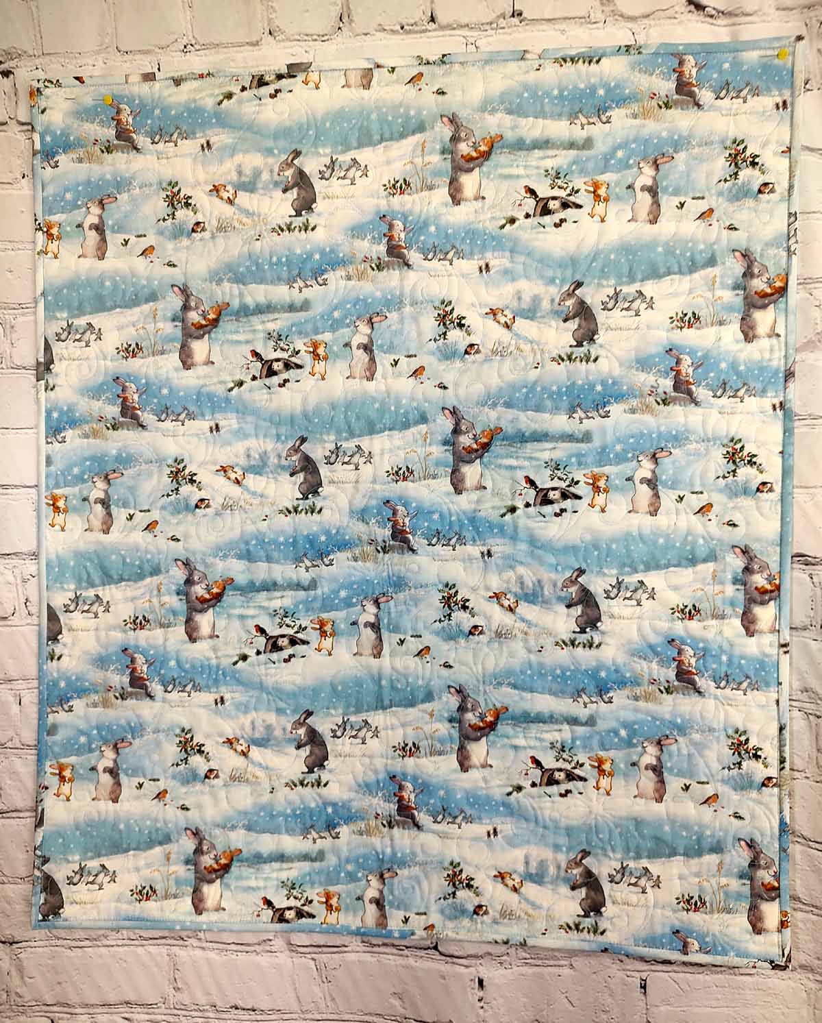 Snow Bunny blue and tan baby quilt