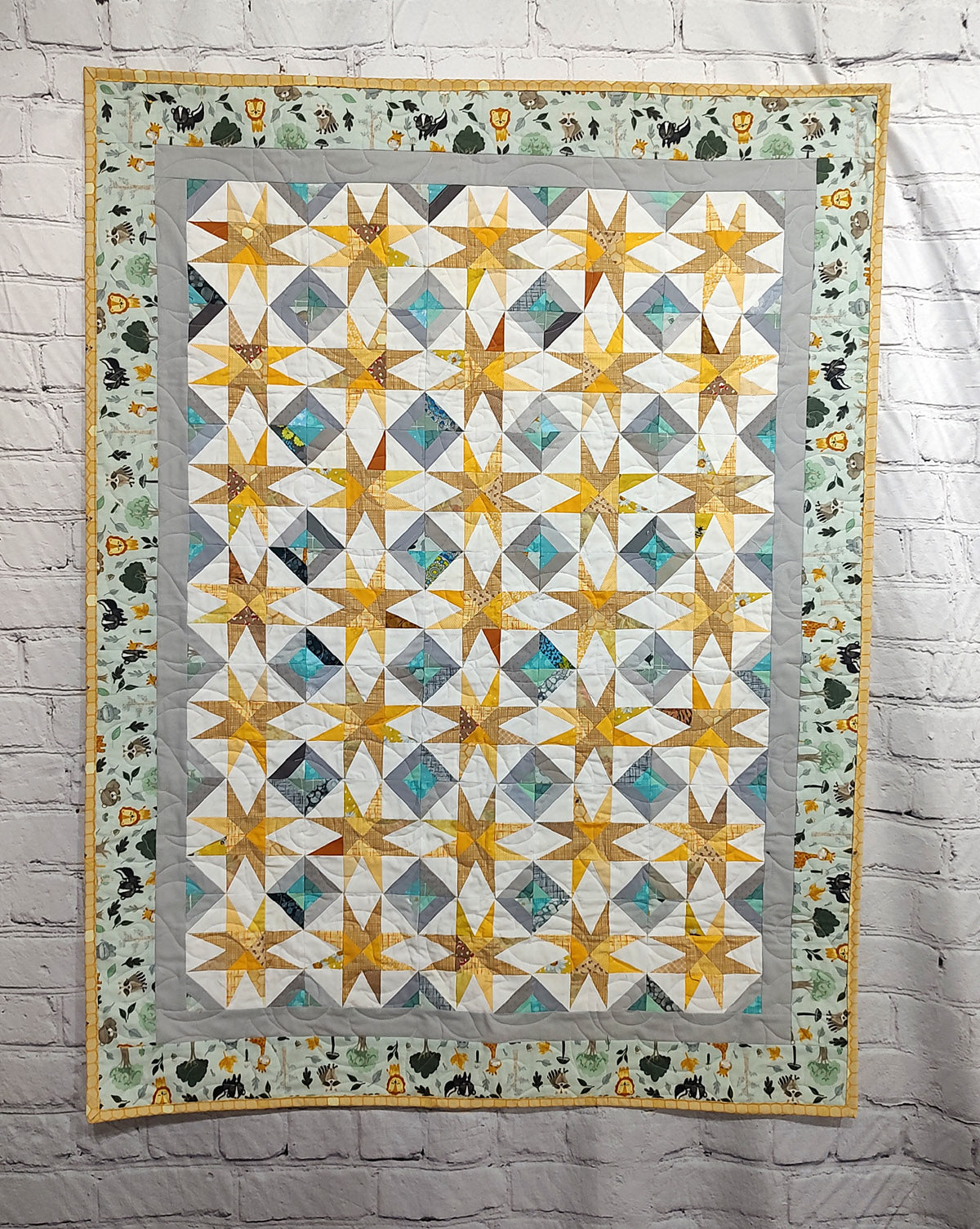 Super Nova scrappy jungle yellow and turquoise Baby Lap quilt