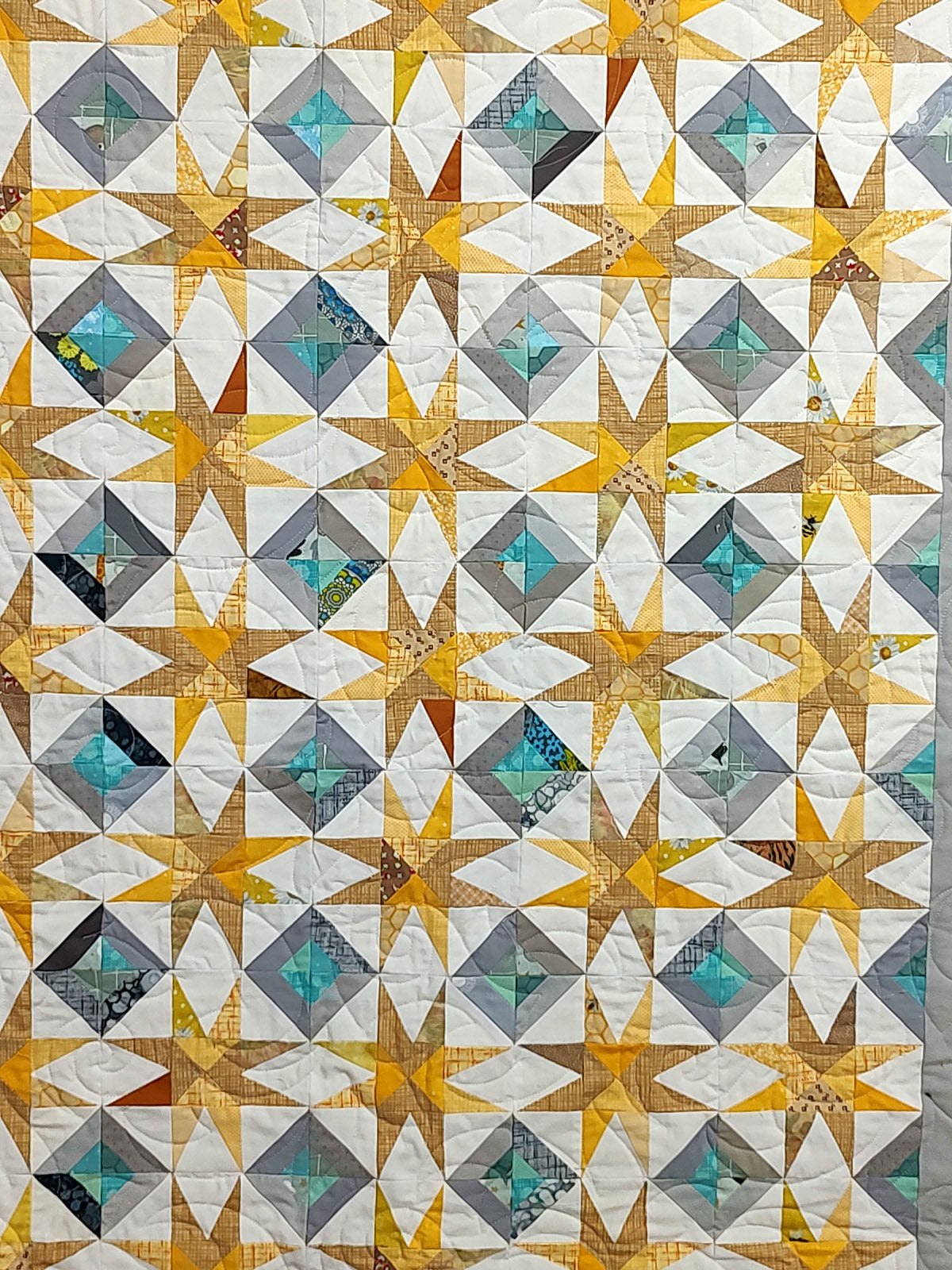 Super Nova scrappy jungle yellow and turquoise Baby Lap quilt