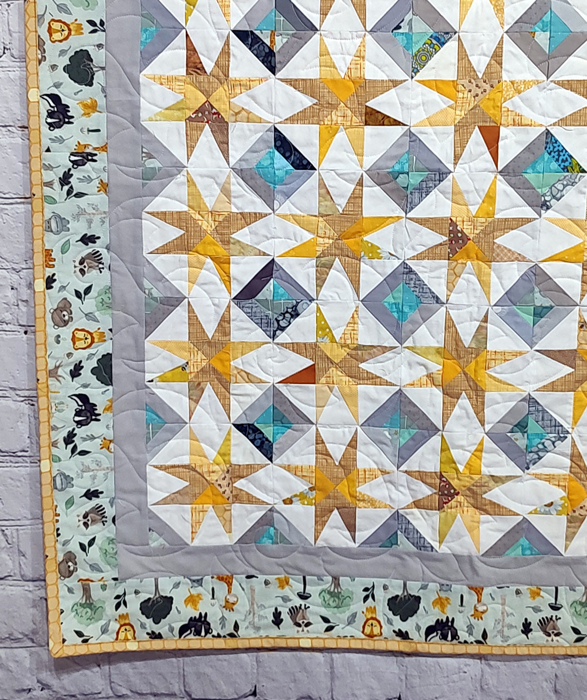 Super Nova scrappy jungle yellow and turquoise Baby Lap quilt