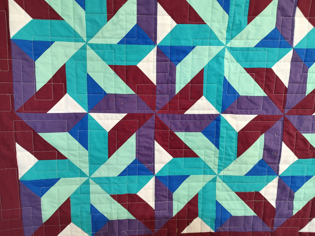 Whirling Star Solid colors purple and blue modern baby lap quilt